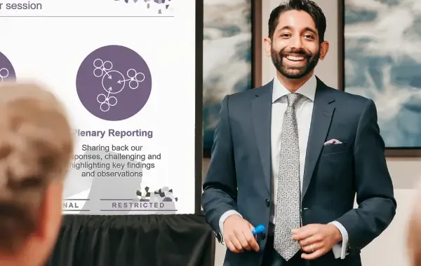 Dr. Harshal Kubavat presenting CI Strategy at a conference.